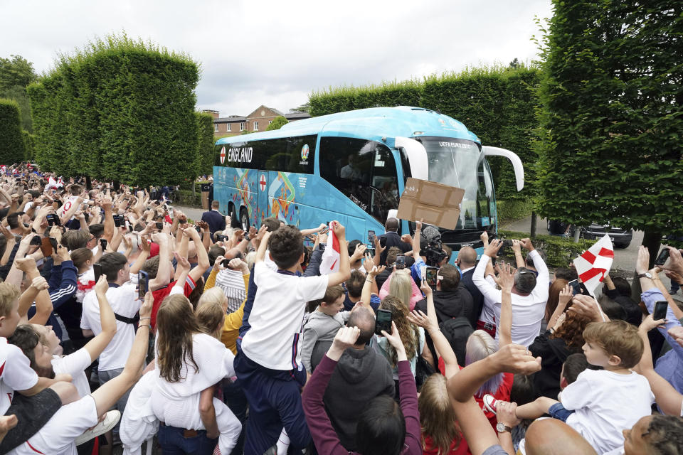 England fans cheer off the official England Team bus as they leave the Grove Hotel, Hertfordshire, England, and head to Wembley Stadium for the Euro 2020 soccer championship final match between England and Italy Sunday July 11, 2021. (Jonathan Brady//PA via AP)