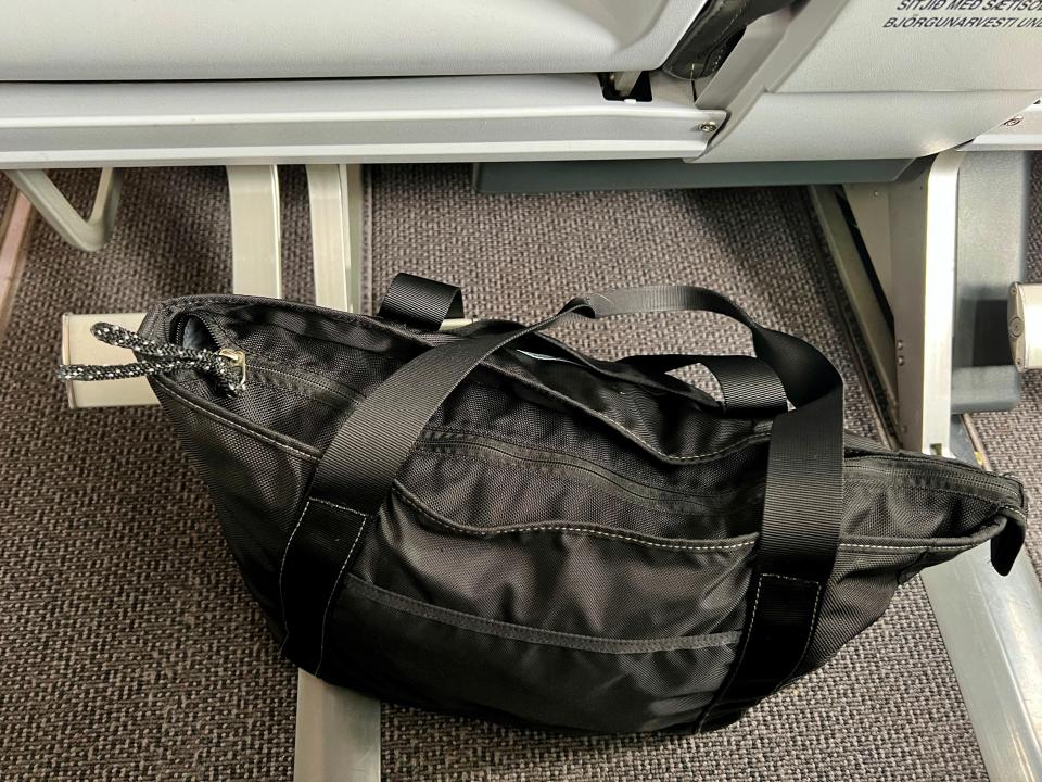 black bag on floor of plane