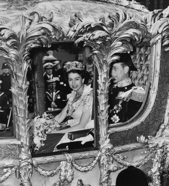 PHOTO: Queen Elizabeth II with Prince Philip, Duke of Edinburgh looks out from her Coronation Coach as she makes her way to Westminster Abbey for Coronation ceremony, June 2, 1953 in London. (Fox Photos/Getty Images)