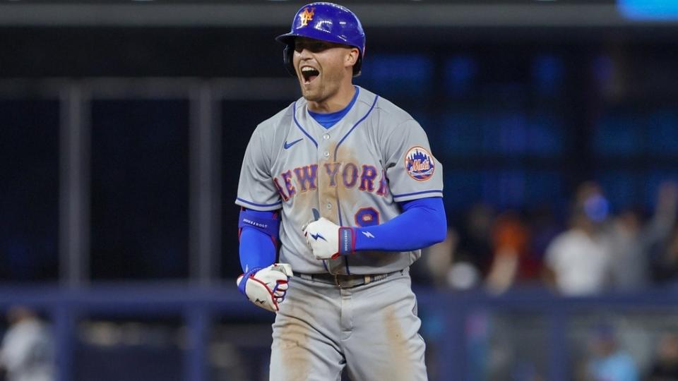 Mar 30, 2023; Miami, Florida, USA; New York Mets center fielder Brandon Nimmo (9) reacts from second base after hitting a two-run double during the seventh inning against the Miami Marlins at loanDepot Park.