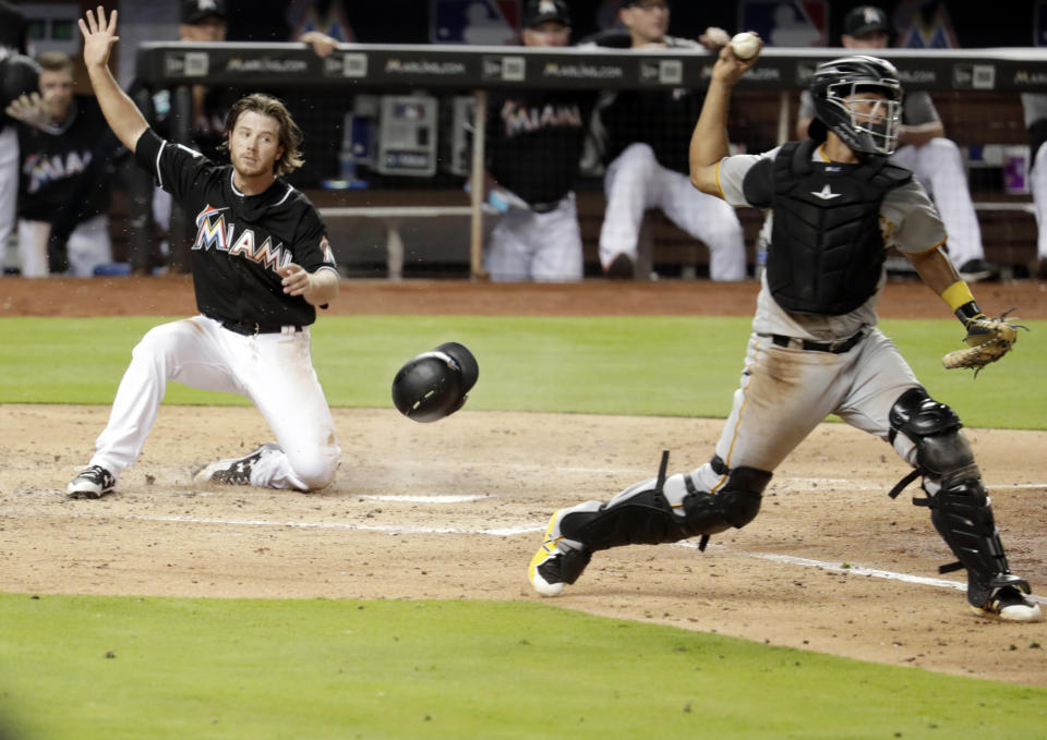 Pirates catcher Elias Diaz probably wishes he could have this throw back against the Marlins. (AP Photo)