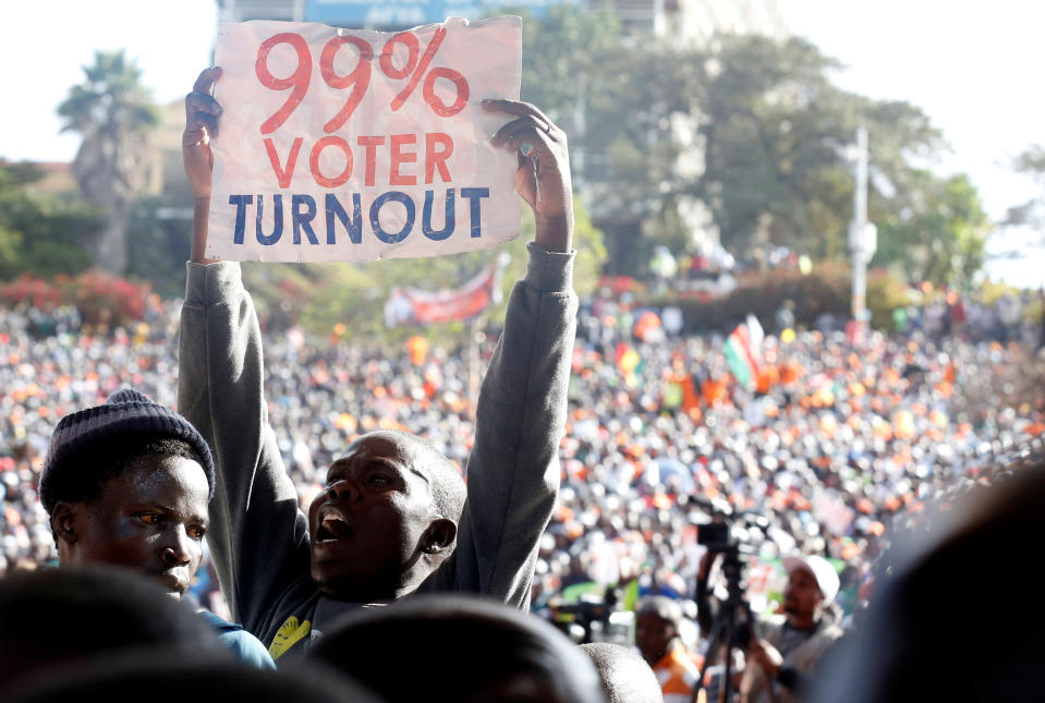 <p>A supporter of Kenyan opposition National Super Alliance (NASA) coalition’s Presidential candidate Raila Odinga displays a placard during their final campaign rally at the Uhuru park grounds in Nairobi, Kenya, Aug. 5, 2017. (Photo: Thomas Mukoya/Reuters) </p>