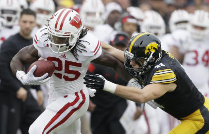 Melvin Gordon runs from Iowa linebacker Bo Bower during Wisconsin's win. (AP)