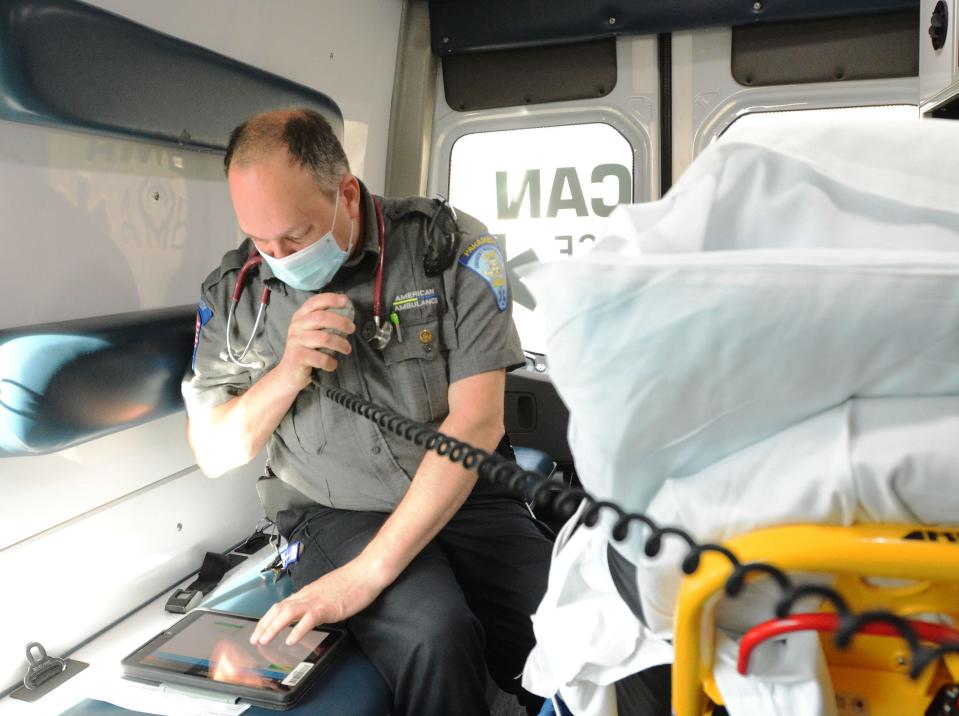 Paramedic Peter Haberek calls in vitals from a patient with respiratory distress to The William W. Backus Hospital Emergency Department in Norwich.