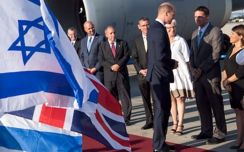 The Duke on the red carpet meeting delegates as Israeli and British flags flutter in the breeze - Credit: Arthur Edwards/Newsgroup UK