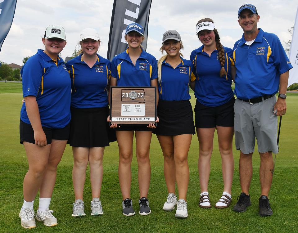 Canton's Olivia Sorlie holds the third-place team championship trophy at the Class A girls state golf meet in Sioux Falls on June 7, 2022. Sorlie won medalist honors in the tourney.