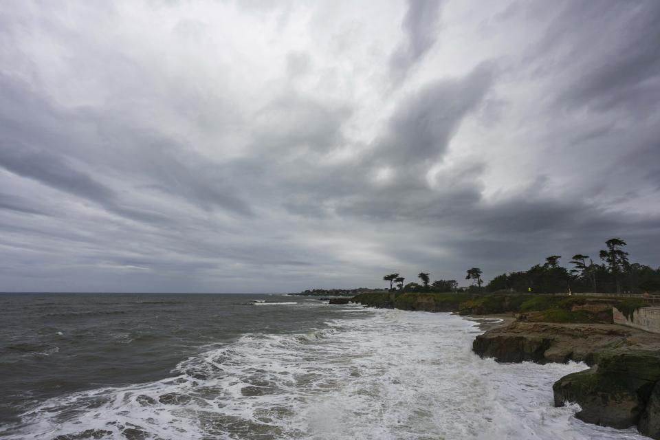 Storm clouds hang over West Cliff Drive in Santa Cruz, Calif., on Wednesday, Jan. 31, 2024. (AP Photo/Nic Coury)