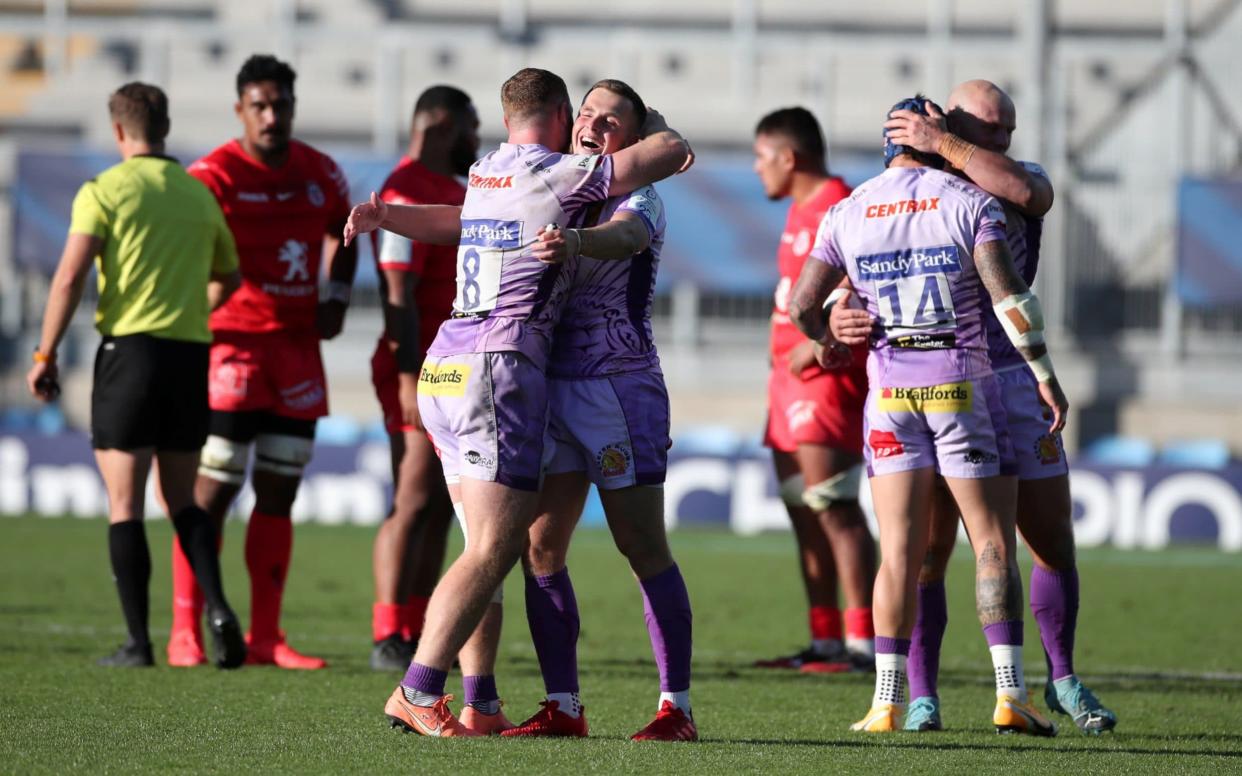 Exeter Chiefs' Joe Simmonds and Sam Simmonds celebrate victory at the end. - REUTERS