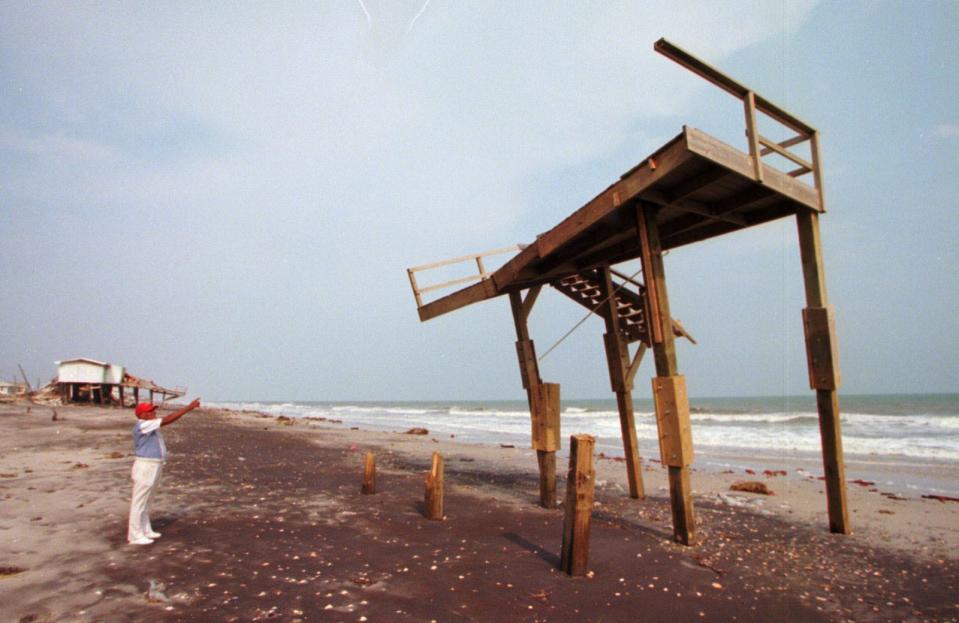 This lone sun deck was all that remained of a row of ocean front homes on North Topsail Beach Sept. 9, 1996. An entire row of homes and the road adjacent were erased by Hurricane Fran.