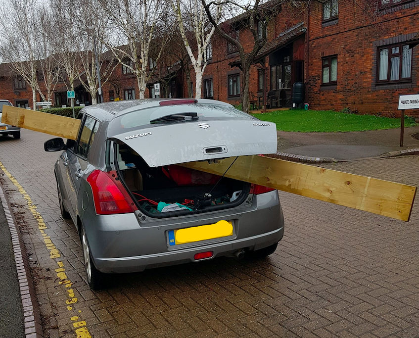 Police discovered the huge plank of wood sticking through the passenger window and protruding out the back of the car. (SWNS)