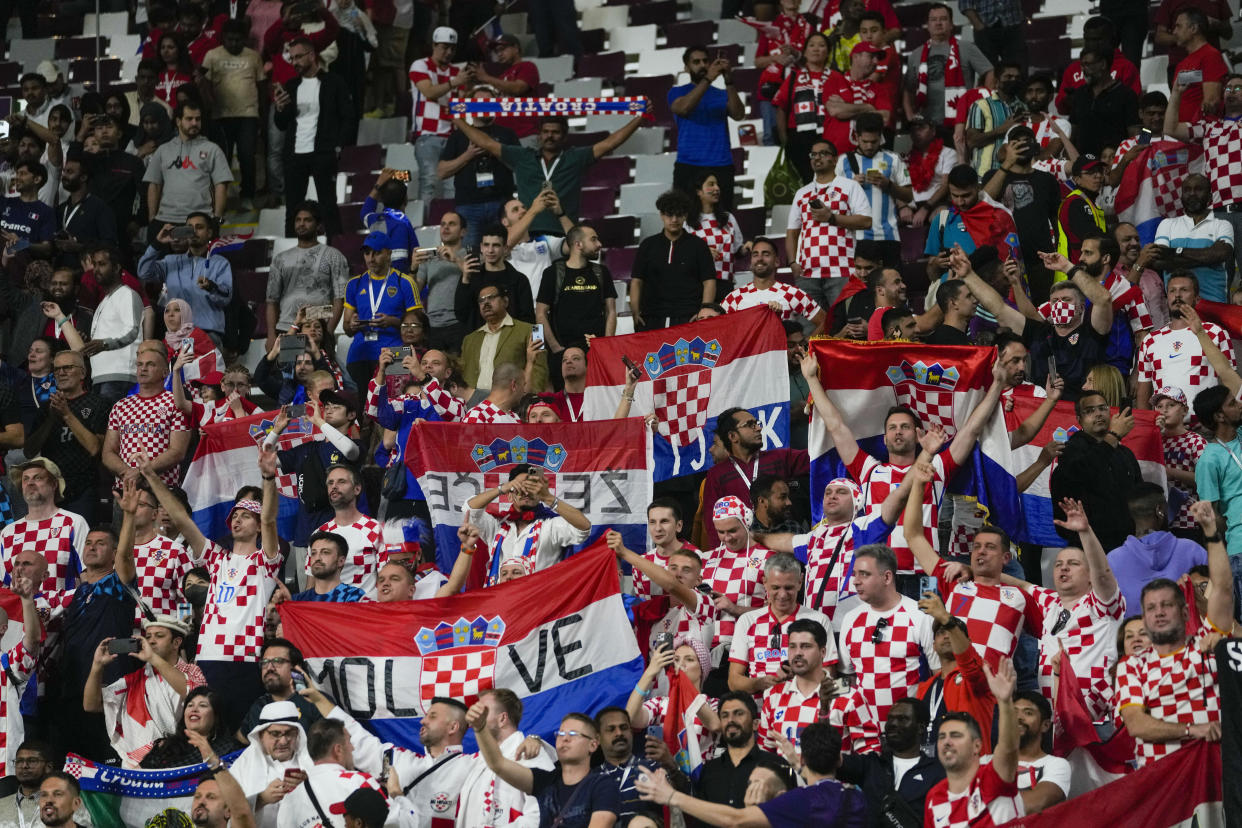 Croatia's soccer team fans celebrate their 4-1 victory over Canada during the World Cup group F soccer at the Khalifa International Stadium in Doha, Qatar, Sunday, Nov. 27, 2022. (AP Photo/Darko Vojinovic)