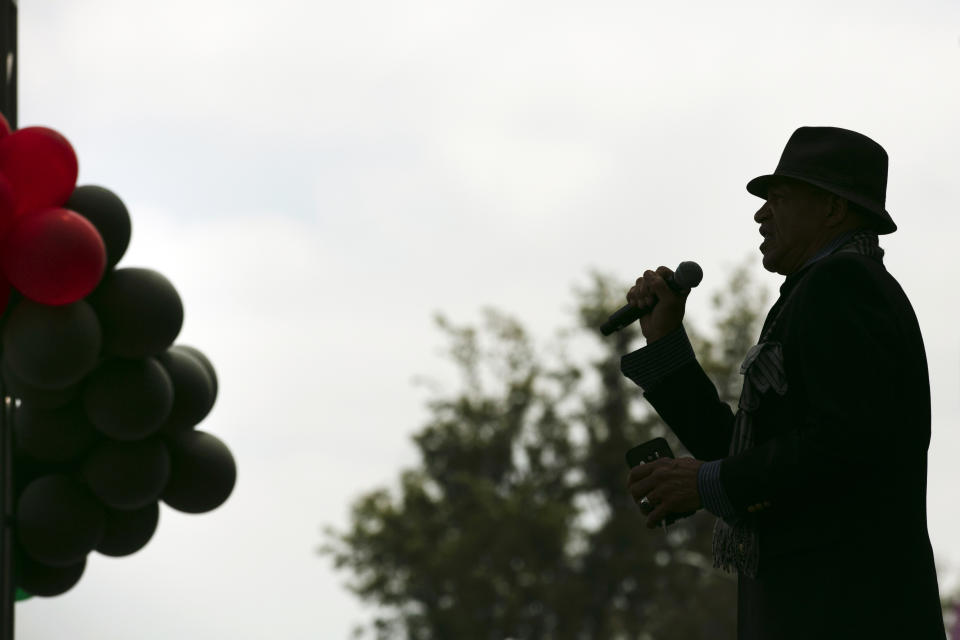 FILE - In the June 19, 2020 file photo, Imani Abdul sings "Lift Every Voice and Sing" during a Juneteenth celebration in Los Angeles. The Black national anthem was born more than a century ago, but the popular hymn within the African American community called "Lift Every Voice and Sing" has been resurrected as a beacon of hope for all races during nationwide protests. (AP Photo/Jae C. Hong, File)