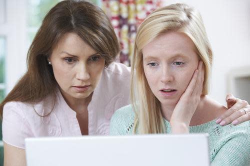 Mother and daughter looking at a laptop
