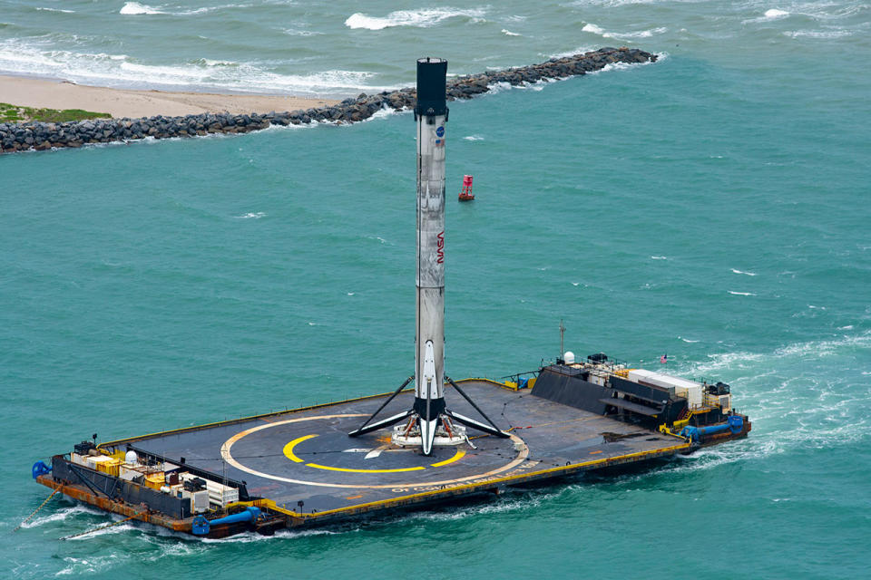 booster sitting on top of a drone ship