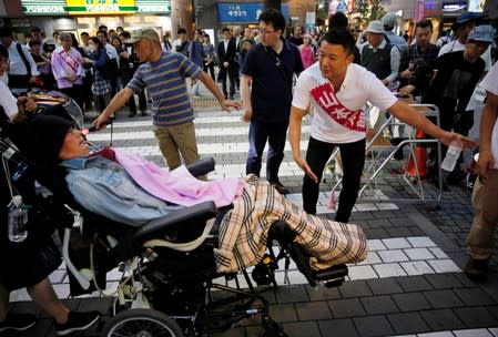 Reiwa Shinsengumi's cadidate for Japan's July 21 upper house election, who has ALS, attends an election campaign in Tokyo