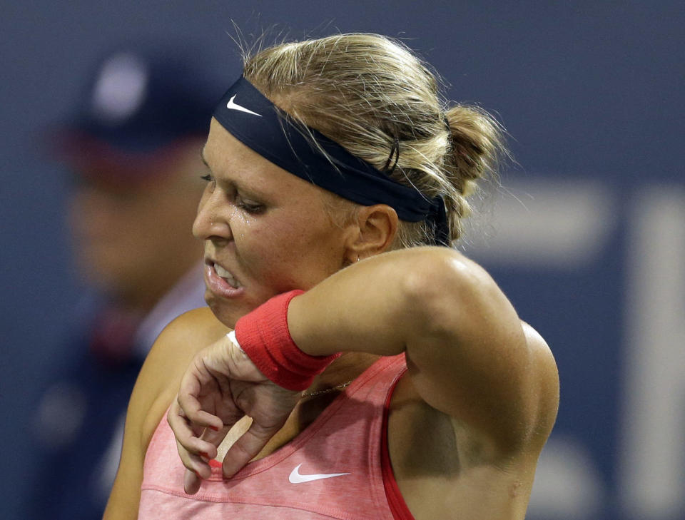 Czech Republic's Lucie Hradecka wipes her face during a match against Angelique Kerber, of Germany, in an opening round of the U.S. Open tennis tournament Monday, Aug. 26, 2013, in New York. (AP Photo/Darron Cummings)