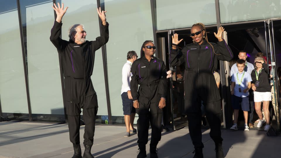 Space tourists, from left, Jon Goodwin, Anastatia Mayers and her mother, Keisha Schahaff, are seen before boarding their Virgin Galactic flight at Spaceport America, near Truth or Consequences, New Mexico. - Andres Leighton/AP