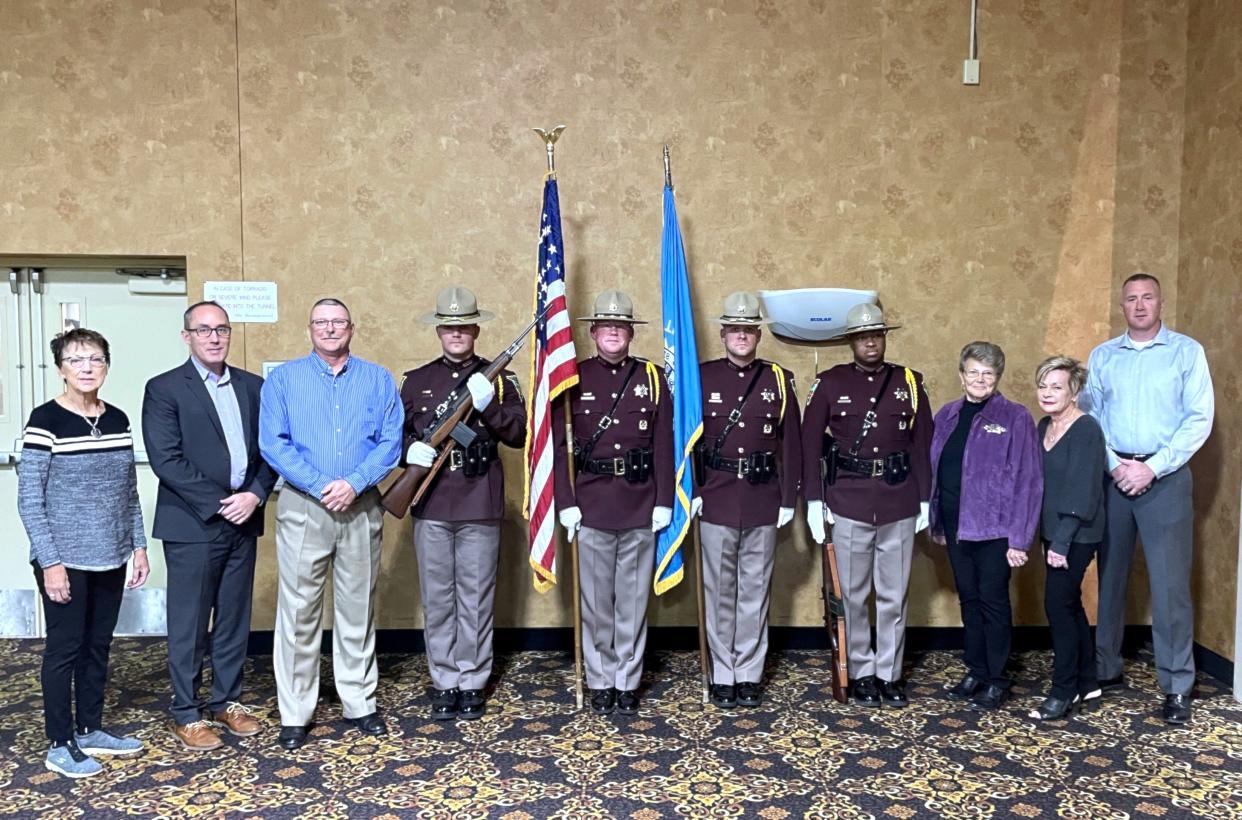 Beef Bucks Vice-President Eileen Miller, left, SD Highway Patrol Major Jason Ketterling, Major Joel Peterson, Honor Guard, Beef Bucks Executive Secretary Nancy Montross, President JoAnne Hillman and SD Highway Patrol Colonel Rick Miller.