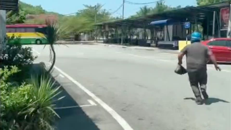 A man runs away from a religious police raid on a restaurant in the state of Perak. Image taken from a video of the raid that was released on TikTok by local authorities. - padgerik33300/TikTok