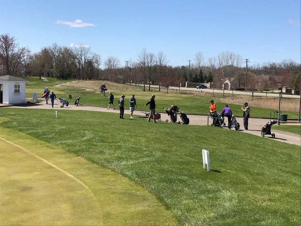 Golfers at the Orchards Golf Club in Washington, Mich. on Friday, May 1, 2020.