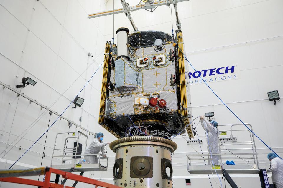 Technicians last week connect the Psyche spacecraft to the payload attach fitting inside the clean room at Astrotech Space Operations facility in Florida. Scientists believe the mysterious asteroid might be the exposed core of an ancient planet.