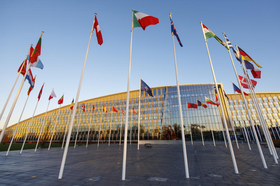 Flags of NATO members fly outside the NATO headquarters, Wednesday, Nov. 16, 2022 in Brussels. Ambassadors from the 30 NATO nations gathered for emergency talks after Poland said that a Russian-made missile fell on its territory killing two people and U.S. President Joe Biden and his allies promised support for the investigation into the incident. (AP Photo/Olivier Matthys)