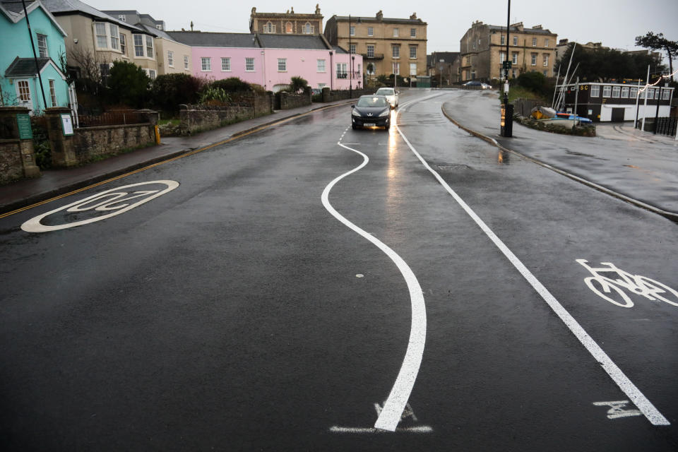 Bemused locals have been questioning the use of â€˜wiggly linesâ€™ in a controversial road scheme in Clevedon - claiming the new layout has turned the town into â€˜Balamory from hellâ€™. North Somerset Council started work on the new road layout along The Beach last autumn, with many local residents and businesses objecting to the changes. Clevedon, Somerset. 10 January 2023. 