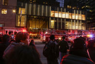 <p>People watch NYPD officers and first responders assess the scene of a fire at Trump Tower on April 7, 2018 in New York City. (Photo: Eduardo Munoz Alvarez/Getty Images) </p>