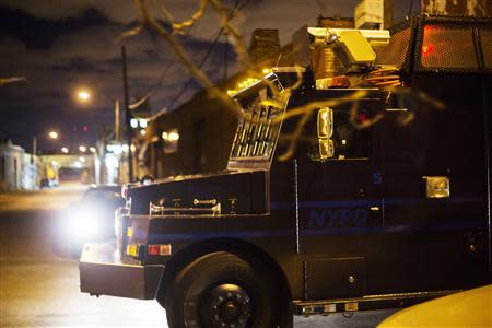 A New York Police Department tactical vehicle arrives at the scene of a multiple shooting crime scene on Maujer Street in the Brooklyn borough of New York, November 11, 2013. REUTERS/Lucas Jackson