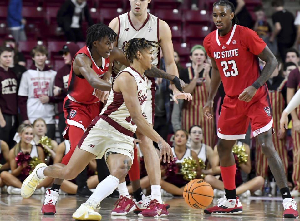 Boston College's Makai Ashton-Langford (11) maneuvers through the North Carolina State defense during the first half of an NCAA college basketball game, Saturday, Feb. 11, 2023, in Boston. (AP Photo/Mark Stockwell)