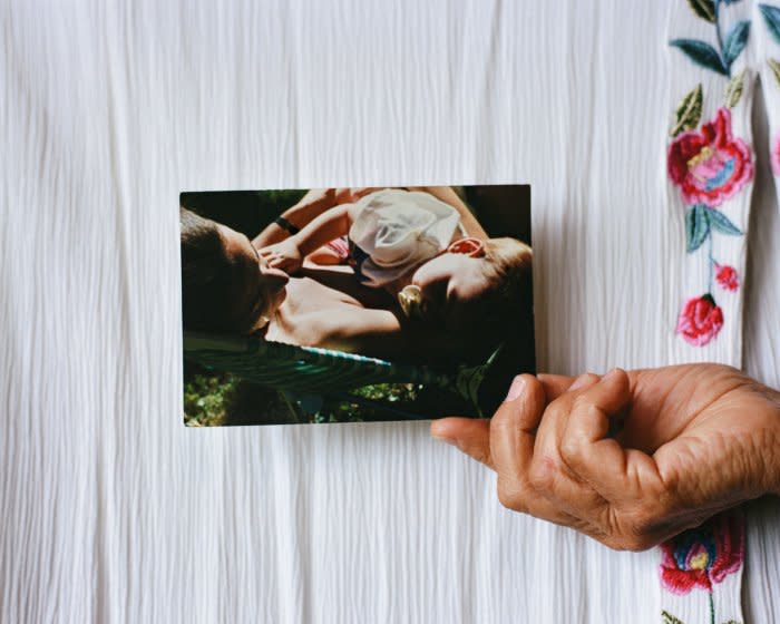 The photograph being held was made by Mama Lu in 1993 of Mama Flavia holding me while I slept on her chest.<span class="copyright">Quetzal Maucci</span>