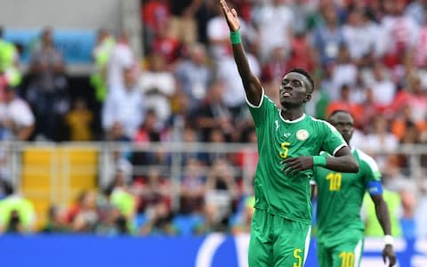 Senegal's midfielder Idrissa Gana Gueye reacts after Poland's conceded a goal  - Credit: AFP