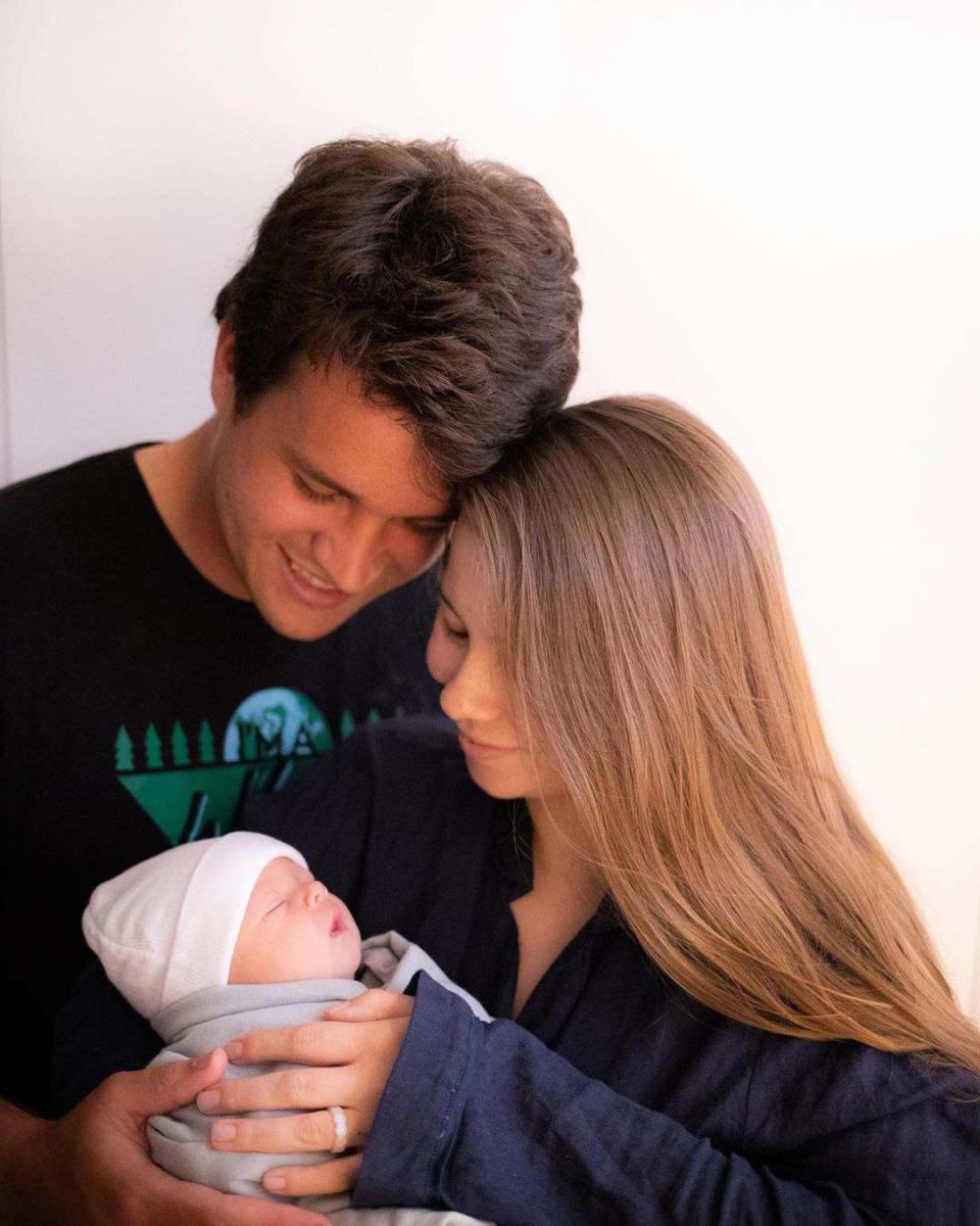 <p>She's here! Bindi Irwin and her husband Chandler Powell <a href="https://people.com/parents/bindi-irwin-husband-chandler-powell-welcome-daughter/" rel="nofollow noopener" target="_blank" data-ylk="slk:welcomed their first child together;elm:context_link;itc:0;sec:content-canvas" class="link ">welcomed their first child together</a>, a daughter, on March 25 (their first wedding anniversary!), they announced alongside sweet photos of the newborn on <a href="https://www.instagram.com/p/CM4Tcp4haH0/?utm_source=ig_embed" rel="nofollow noopener" target="_blank" data-ylk="slk:Instagram;elm:context_link;itc:0;sec:content-canvas" class="link ">Instagram</a>. </p> <p>"March 25, 2021. Celebrating the two loves of my life. Happy first wedding anniversary to my sweetheart husband and day of birth to our beautiful daughter. ❤️ Grace Warrior Irwin Powell," began Irwin, 22. </p> <p>"Our graceful warrior is the most beautiful light. Grace is named after my great-grandmother, and relatives in Chandler's family dating back to the 1700s," she said of the moniker's special significance. "Her middle names, Warrior Irwin, are a tribute to my dad and his legacy as the most incredible Wildlife Warrior. Her last name is Powell and she already has such a kind soul just like her dad. There are no words to describe the infinite amount of love in our hearts for our sweet baby girl. She chose the perfect day to be born and we feel tremendously blessed."</p> <p>The<i> Crikey! It's the Irwins</i> star revealed that their daughter was born at 5:52 p.m. and weighed 7 Lbs. and 7 oz, measuring at 20 inches long.</p> <p>On <a href="https://www.instagram.com/p/CM4UoMrhP2Q/" rel="nofollow noopener" target="_blank" data-ylk="slk:his own Instagram page;elm:context_link;itc:0;sec:content-canvas" class="link ">his own Instagram page</a>, Chandler shared the same photos, writing his own sweet tribute to their new addition. </p>