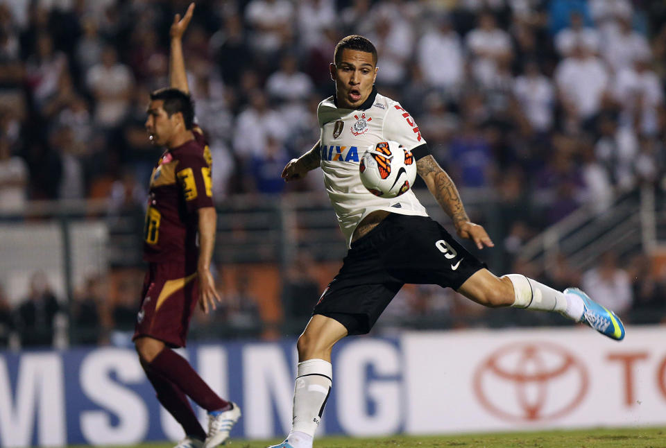 FILE - In this April 10, 2013 file photo, Paolo Guerrero, of Brazil's Corinthians, shoots to score against Bolivia's San Jose during a Copa Libertadores soccer match in Sao Paulo, Brazil. There will be plenty of talented foreigners in this year’s championship, with Gremio leading the way with Hernan Barcos or Argentina, Cristian Riveros of Paraguay, Eduardo Vargas of Chile and Uruguay’s Maxi Rodriguez. Rival International is led by Andres D’Alessandro of Argentina, while Palmeiras has Chile playmaker Jorge Valdivia and Fluminense has midfielder Dario Conca. Corinthians counts on Peru striker Paolo Guerrero, Botafogo has Uruguayan striker Nicolas Lodeiro and Sao Paulo will be relying on Dorlan Pabon of Colombia and Alvaro Pereira of Uruguay.(AP Photo/Andre Penner, File)