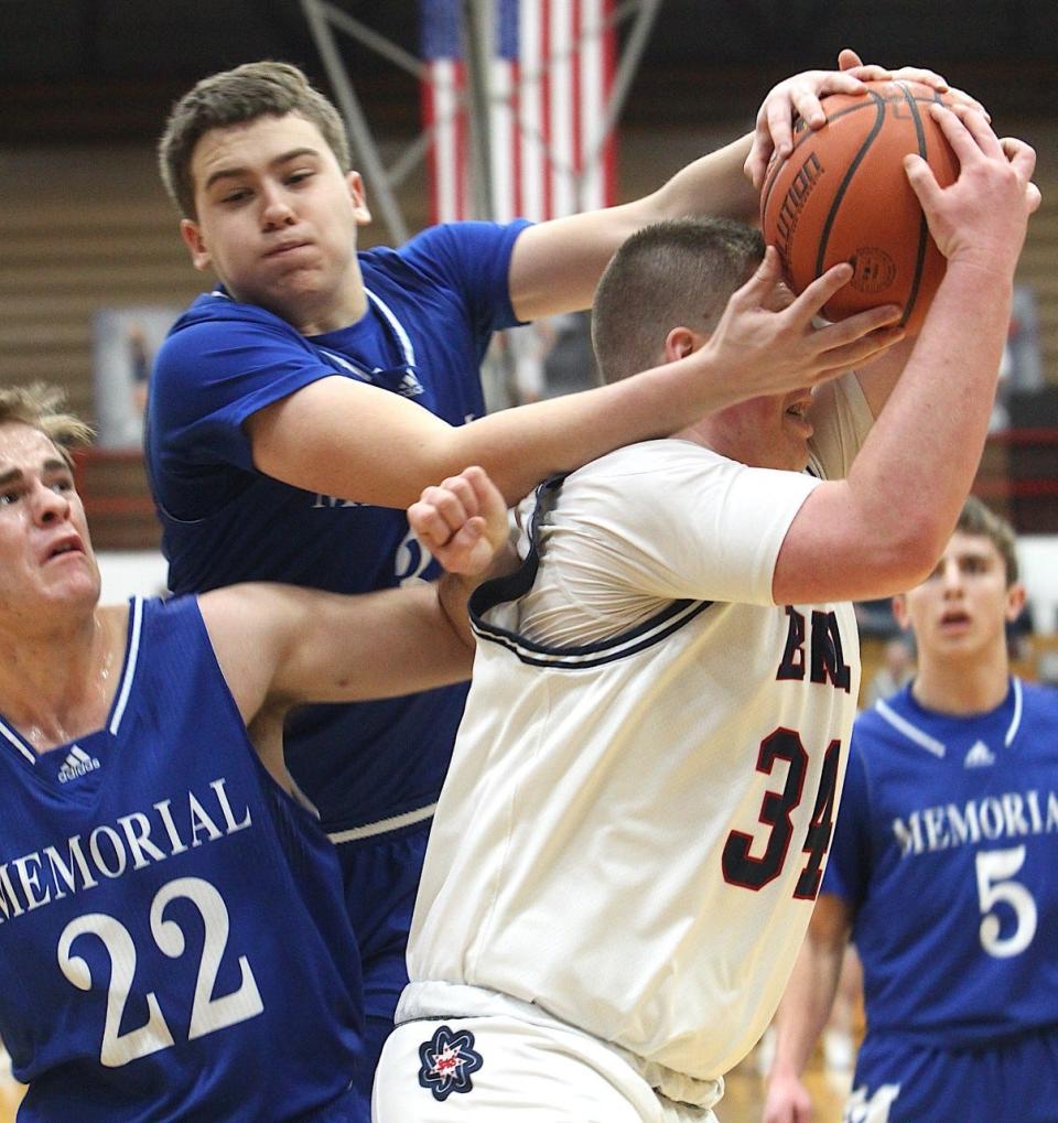 BNL forward Jett Jones (34) pulls down a rebound in heavy traffic Saturday during BNL's 54-52 victory over Evansville Memorial.