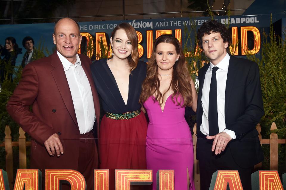 Costars Woody Harrelson, Emma Stone, Abigail Breslin and Jesse Eisenberg pose together at the premiere of their film <em>Zombieland: Double Tap </em>on Thursday in Westwood, California.