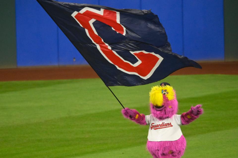 Aug 13, 2024; Cleveland, Ohio, USA; Cleveland Guardians mascot, Slider, celebrates a win over the Chicago Cubs at Progressive Field. Mandatory Credit: David Richard-USA TODAY Sports