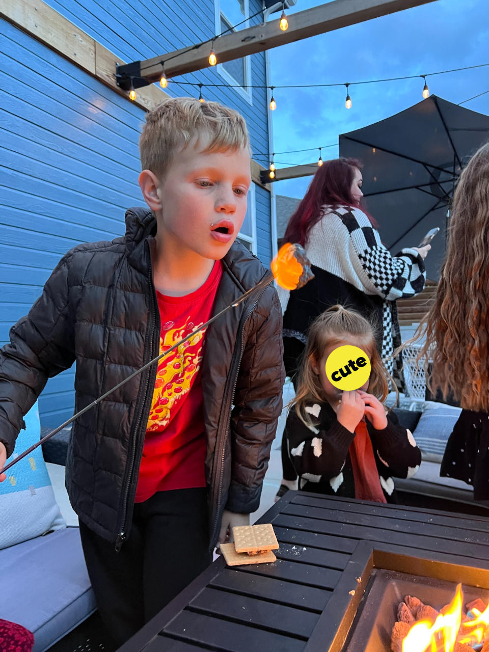 the author's son roasting a marshmallow