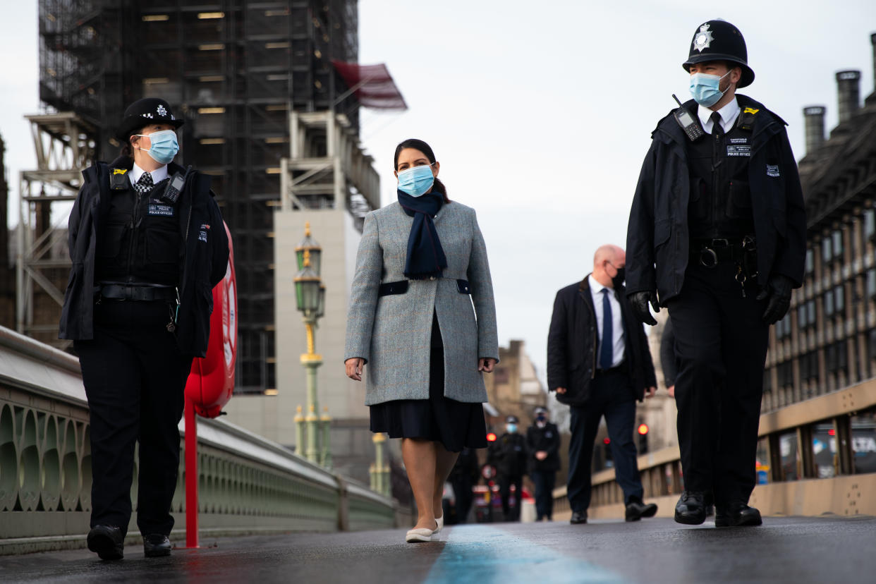 Home Secretary Priti Patel walks across Westminster Bridge whilst on patrol with Metropolitan Police officers in central London, to hear about about Covid enforcement. Picture date: Monday January 18, 2021.