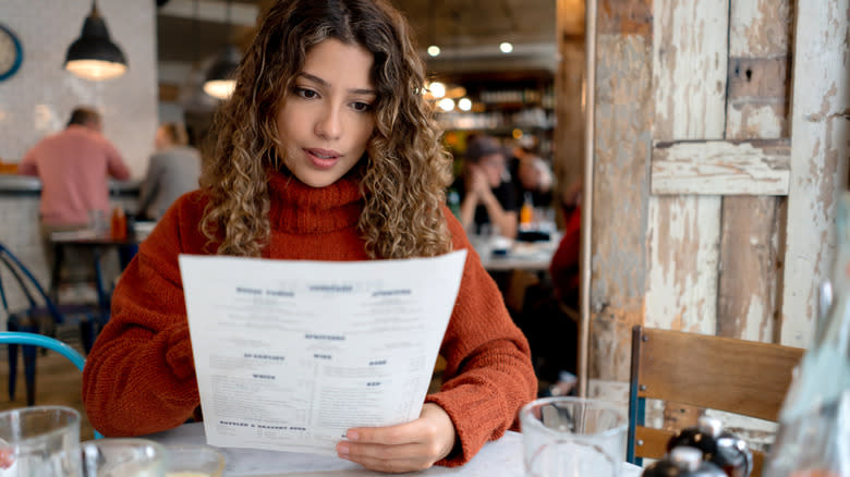 Woman looking at menu