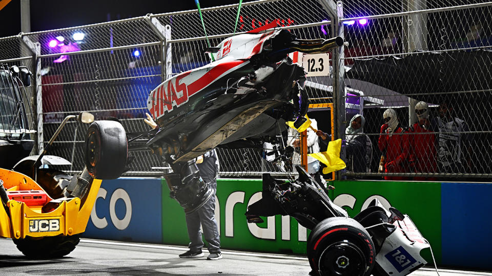 The damage to Mick Schumacher's Haas was so extensive that the car split in two as marshals attempted to lift it onto a tow truck. (Photo by Clive Mason/Getty Images)