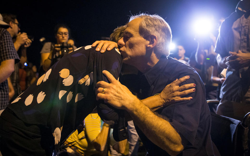 <p>Texas Governor Greg Abbott embraces a woman at a vigil following a mass shooting at the First Baptist Church in Sutherland Springs, Texas, Nov. 5, 2017. (Photo: Nick Wagner/AMERICAN-STATESMAN via Reuters) </p>