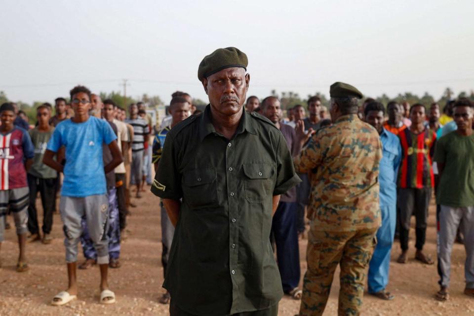 PHOTO: A Sudanese officer speaks to civilians recruited by the army as they take part in a military training in the Kassinger area of Sudan's Northern State on August 9, 2023. (AFP via Getty Images)