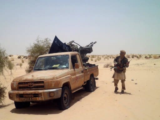 An Islamists rebel of Ansar Dine is pictured near Timbuktu, in April 2012. Mali's embattled transitional government has rejected a rebel alliance's declaration of an Islamic state in the vast desert north, a move that has plunged the nation closer to breakup two months after a coup