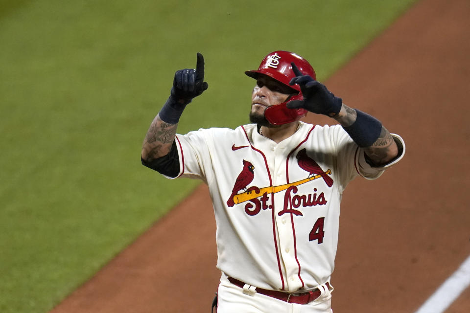 St. Louis Cardinals' Yadier Molina celebrates after hitting a solo home run during the seventh inning of a baseball game against the Chicago Cubs Saturday, May 22, 2021, in St. Louis. (AP Photo/Jeff Roberson)