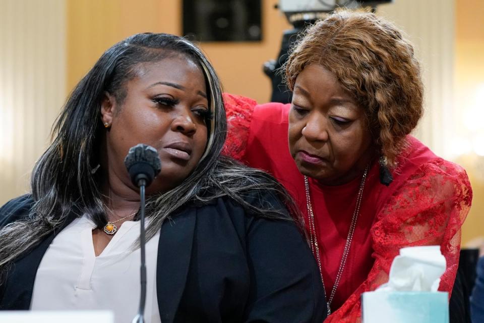 The mother-daughter duo of election workers that Giuliani defamed, Shaye Moss and Ruby Freeman (AP)