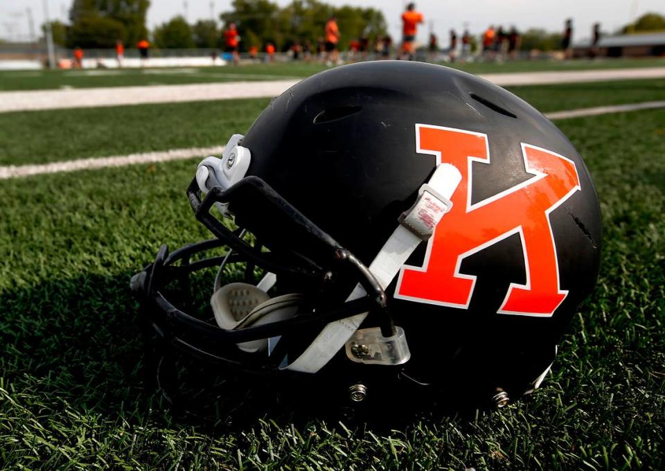 Kennewick High School football helmet on the practice field.