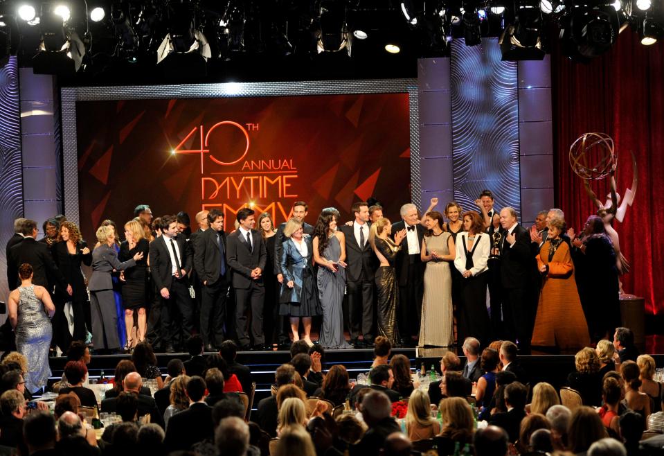 The cast and crew of "Days of Our Lives" accept the award for outstanding drama series at the 40th Annual Daytime Emmy Awards on Sunday, June 16, 2013, in Beverly Hills, Calif.