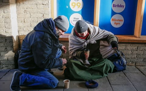 The public are being urged not to give beggars in Ely money - Credit: SWNS