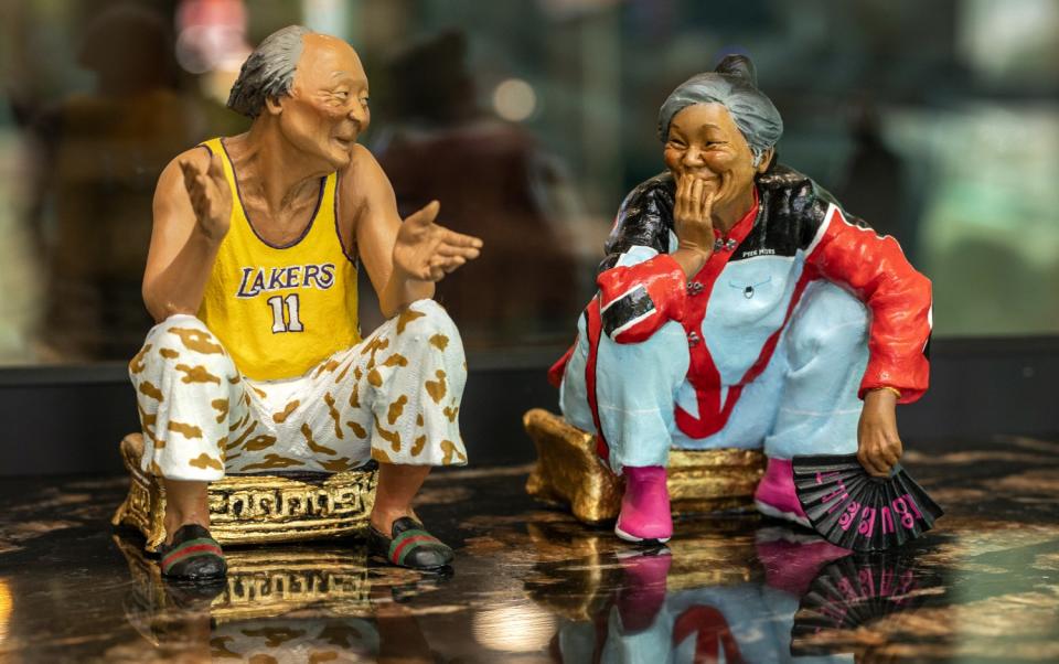 Chinese figurines on display at Chifa restaurant.